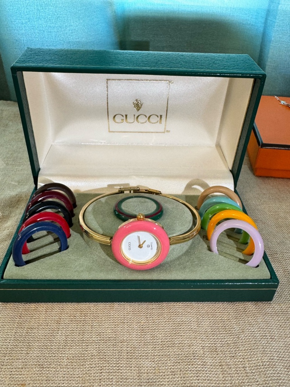 Gucci Gold Bangle Watch with Interchangeable Colorful Bezels